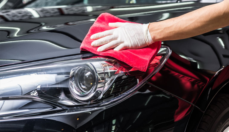 Wiping the Hood of the Car